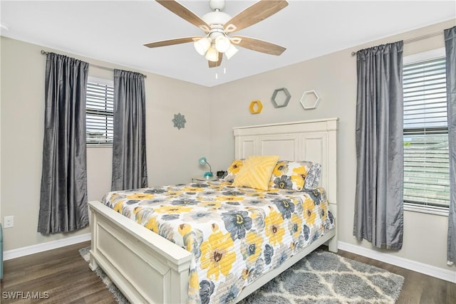 bedroom featuring ceiling fan and dark hardwood / wood-style flooring