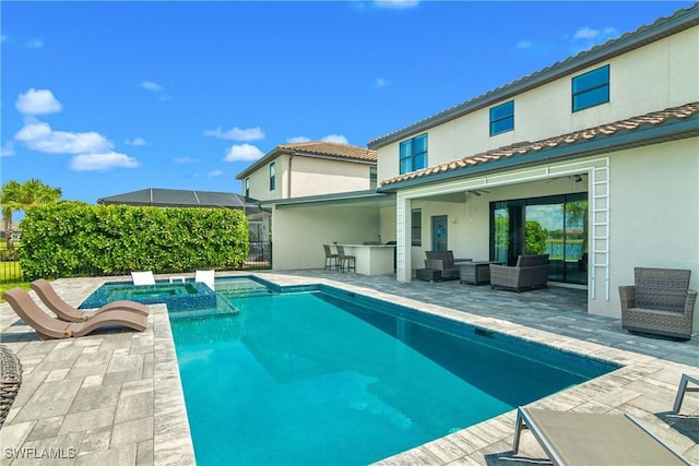 view of pool with an outdoor living space, an outdoor bar, a patio, and an in ground hot tub