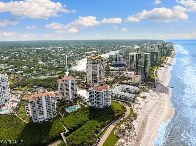 aerial view with a beach view, a water view, and a city view