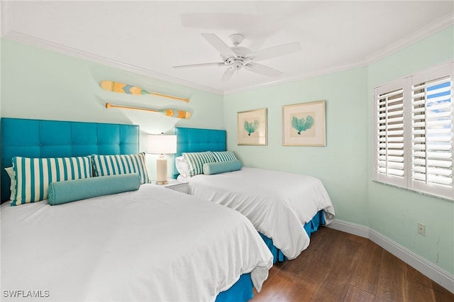 bedroom with ornamental molding, a ceiling fan, baseboards, and dark wood-style floors