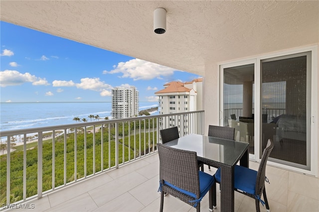 balcony with a view of the beach and a water view