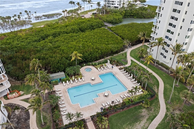 birds eye view of property with a water view