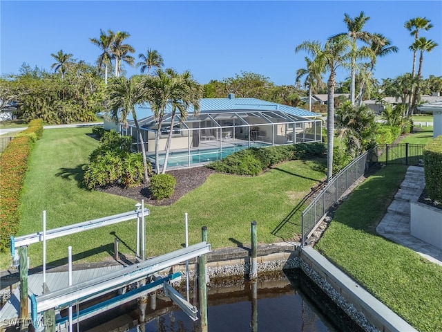 view of dock featuring a lanai, a fenced in pool, a yard, and a water view