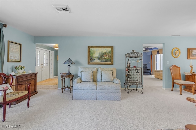 carpeted living room featuring plenty of natural light