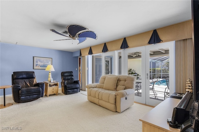 living room featuring ceiling fan and carpet floors