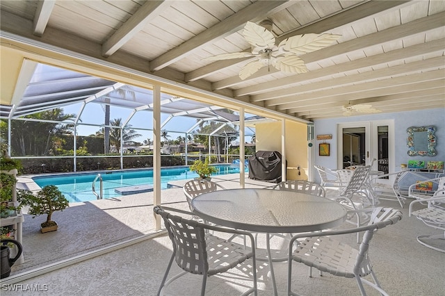 view of pool featuring french doors, a patio, and glass enclosure