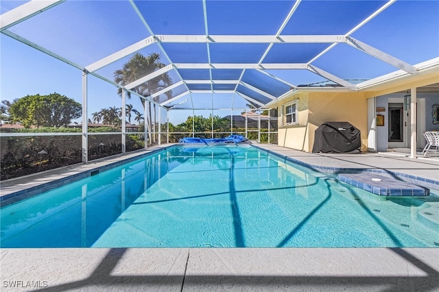 view of pool featuring a grill, a lanai, and a patio area