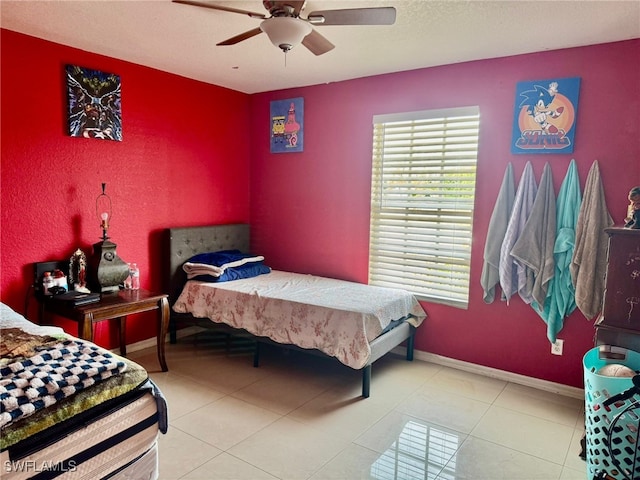 tiled bedroom with ceiling fan