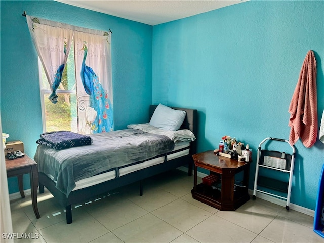 bedroom featuring light tile patterned floors