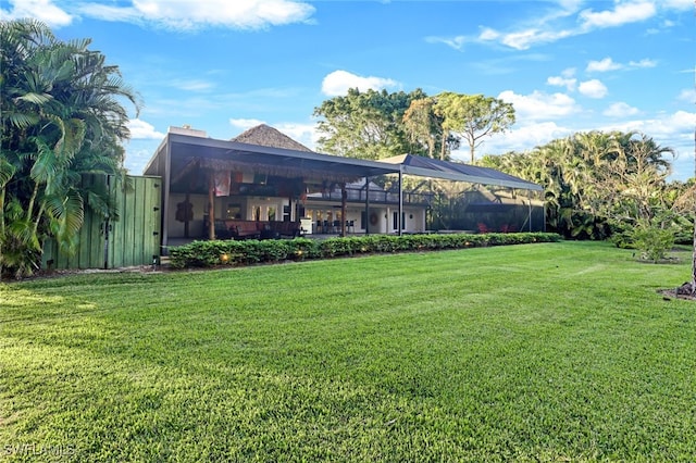 view of yard with a lanai