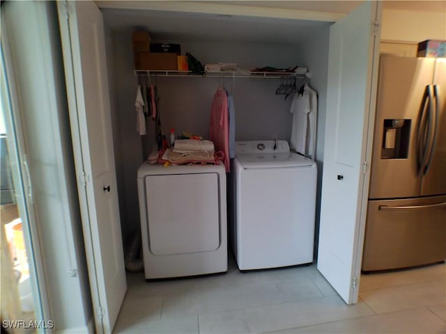 clothes washing area featuring independent washer and dryer