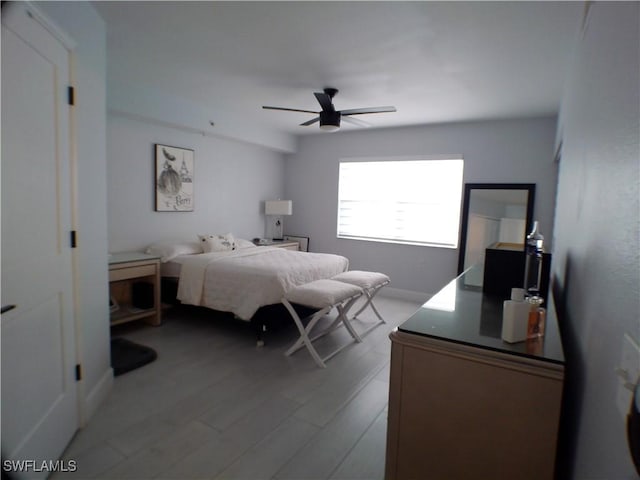 bedroom featuring light wood-type flooring and ceiling fan