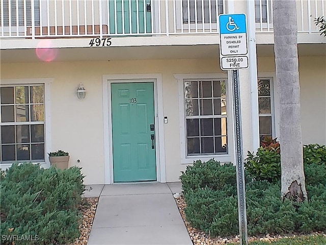 doorway to property featuring a balcony