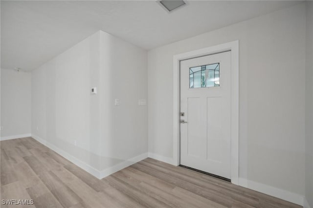 foyer with light hardwood / wood-style floors