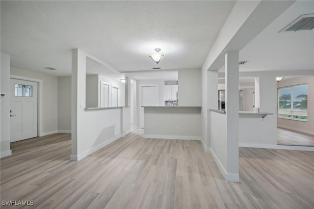 spare room featuring light wood-type flooring