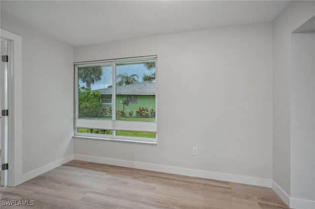 spare room with light hardwood / wood-style floors