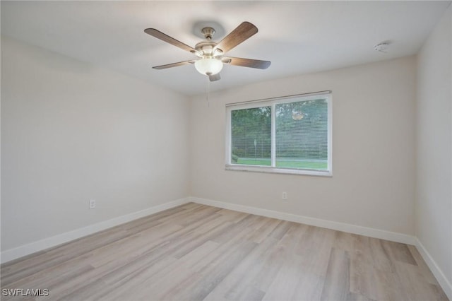 spare room with ceiling fan and light hardwood / wood-style floors