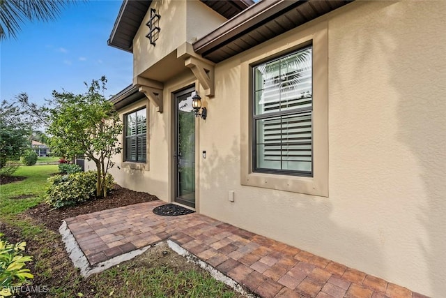 doorway to property with a patio