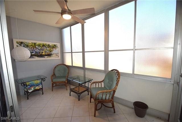 sunroom / solarium with a wealth of natural light and ceiling fan