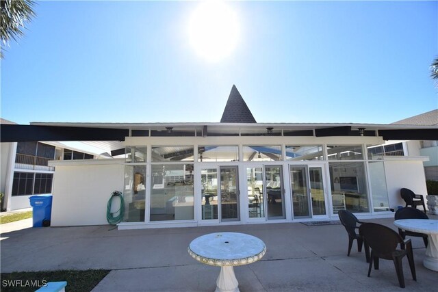 back of house with a patio area