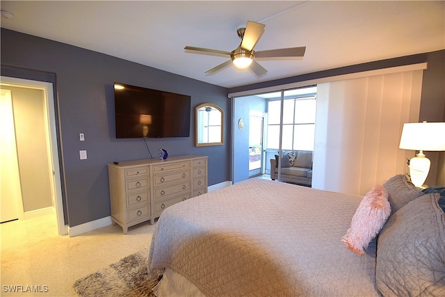 bedroom featuring light carpet and ceiling fan