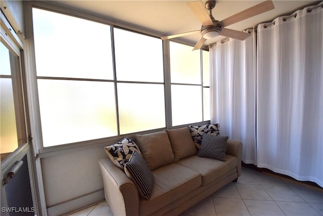 sunroom / solarium featuring a wealth of natural light and ceiling fan