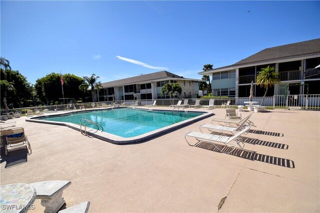 view of swimming pool with a patio