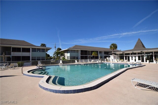 view of swimming pool with a patio