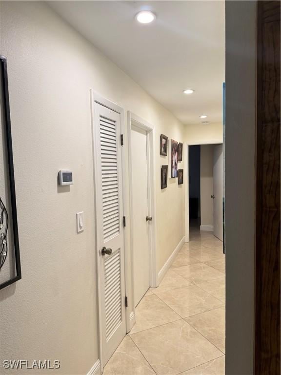 4207 Cindy Ave, Naples, FL 34112 - corridor with baseboards, recessed lighting, and light tile patterned floors