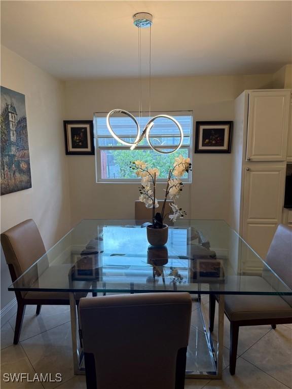 4207 Cindy Ave, Naples, FL 34112 - dining space featuring light tile patterned floors