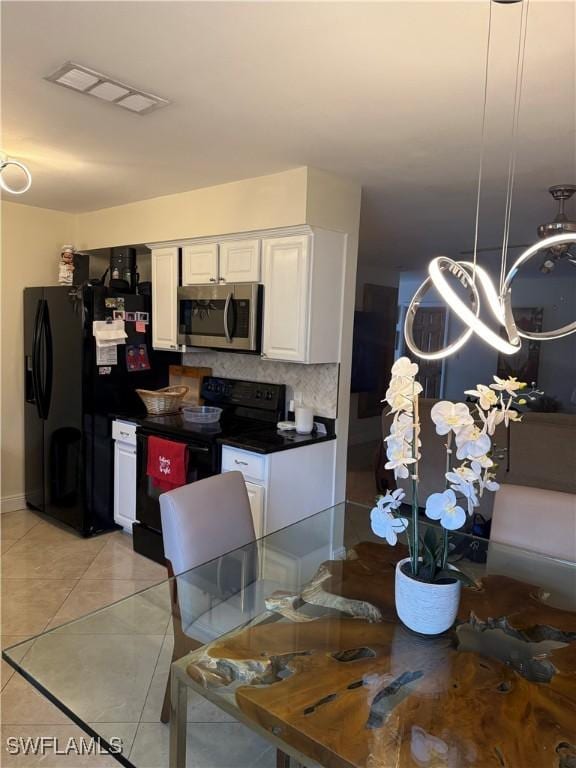 4207 Cindy Ave, Naples, FL 34112 - dining area featuring light tile patterned floors, baseboards, a notable chandelier, and visible vents