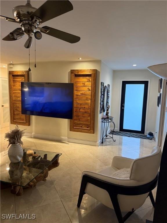4207 Cindy Ave, Naples, FL 34112 - living room with light tile patterned floors, ceiling fan, and recessed lighting