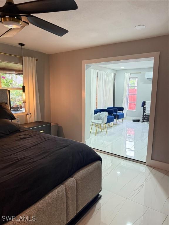 4207 Cindy Ave, Naples, FL 34112 - bedroom featuring access to outside, ceiling fan, a wall mounted AC, and marble finish floor