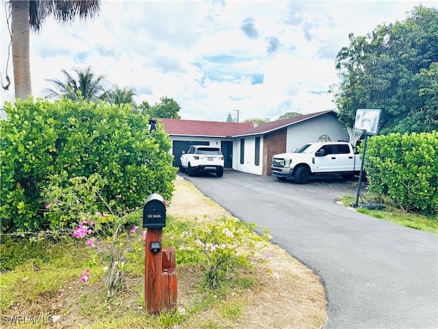 4207 Cindy Ave, Naples, FL 34112 - view of side of property with driveway