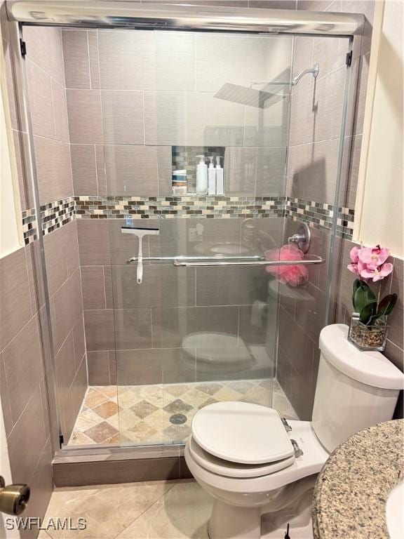 4207 Cindy Ave, Naples, FL 34112 - bathroom featuring a stall shower and toilet