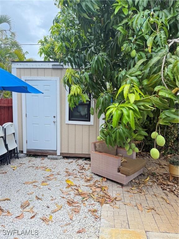 4207 Cindy Ave, Naples, FL 34112 - view of shed featuring fence