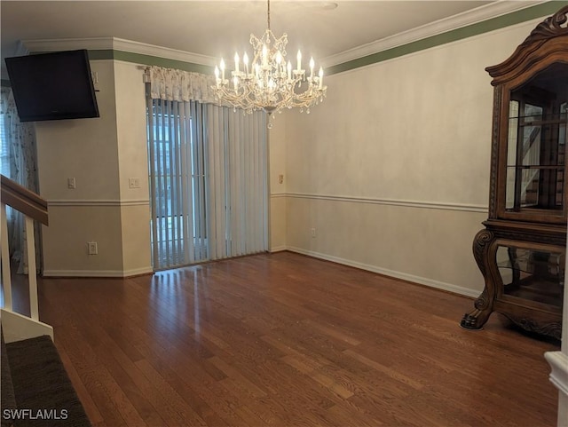 unfurnished dining area featuring crown molding, dark hardwood / wood-style floors, and an inviting chandelier