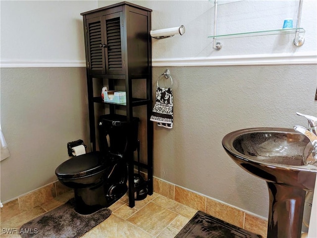 bathroom featuring toilet