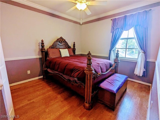 bedroom with ceiling fan, hardwood / wood-style flooring, and ornamental molding