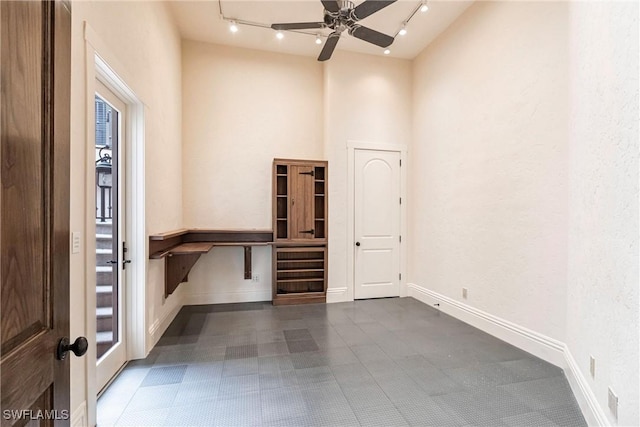 interior space featuring ceiling fan