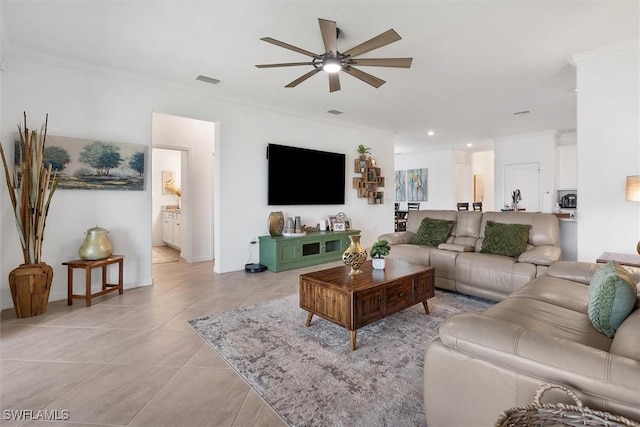 tiled living room featuring ceiling fan and ornamental molding