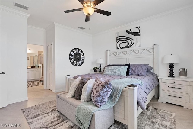 tiled bedroom with ensuite bathroom, ceiling fan, and crown molding