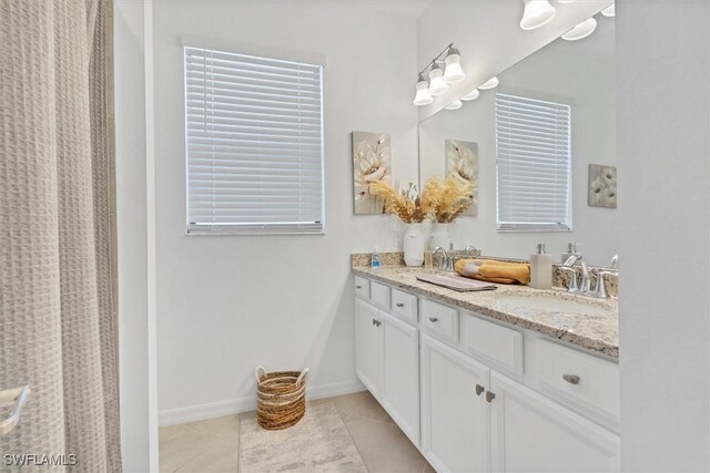 bathroom with tile patterned flooring and vanity