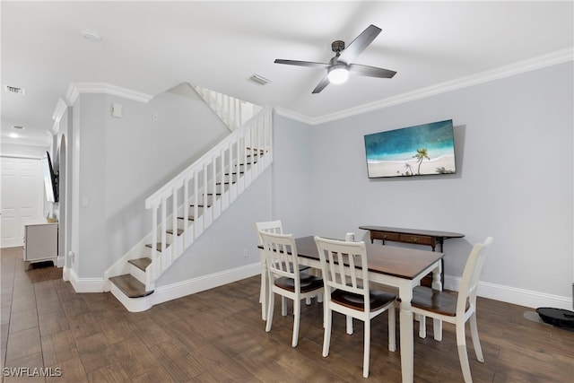 dining area featuring dark wood-type flooring, ceiling fan, and crown molding