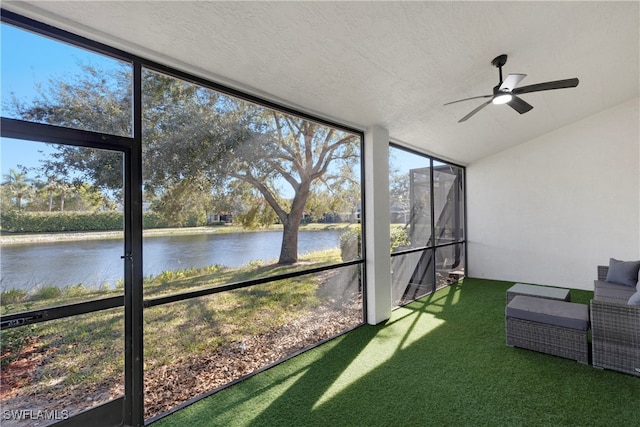 sunroom / solarium with vaulted ceiling and a water view