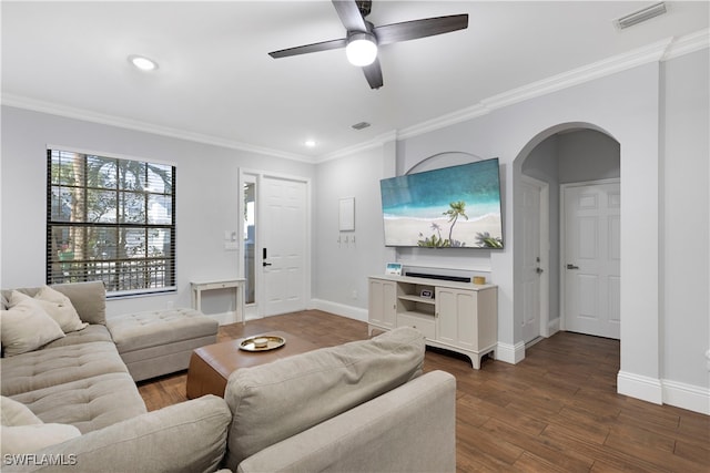 living room with crown molding, ceiling fan, and dark hardwood / wood-style floors