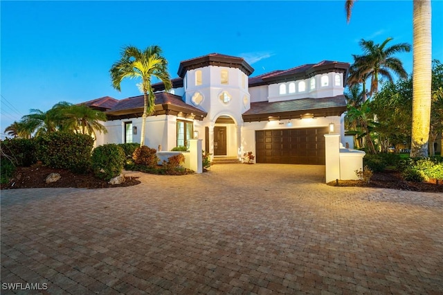 mediterranean / spanish house featuring a garage