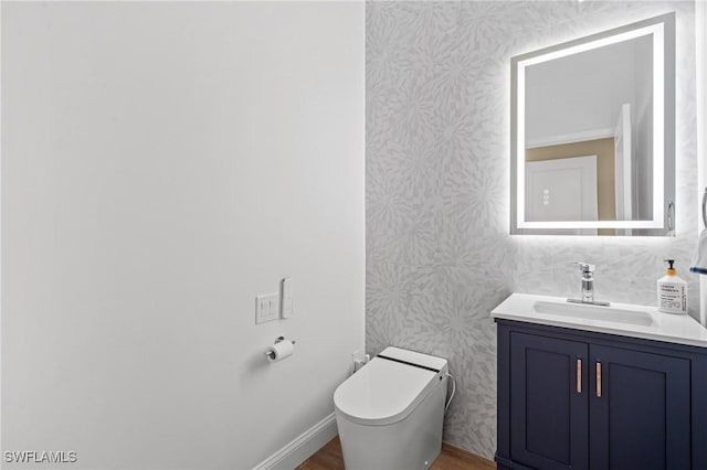 bathroom with vanity and toilet