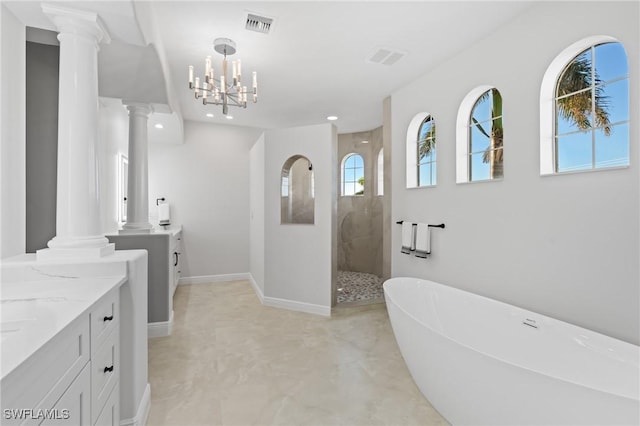 bathroom with vanity, shower with separate bathtub, and a notable chandelier