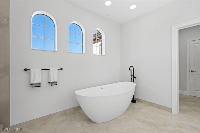 bathroom featuring a washtub